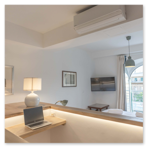 Dettagli di arredo raffinati in un serviced apartment a Genova.